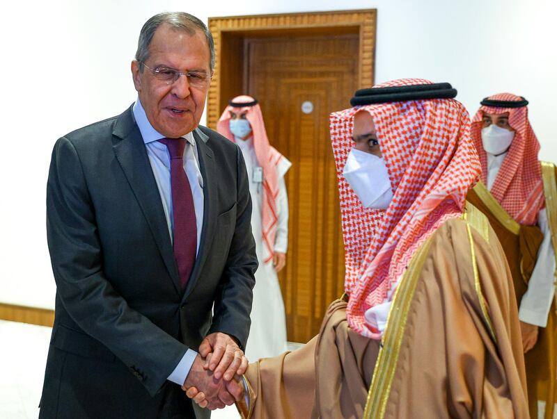 Russian Foreign Minister Sergey Lavrov and Saudi Foreign Minister Prince Faisal bin Farhanshake hands prior to their talks in Riyadh, Saudi Arabia. AP