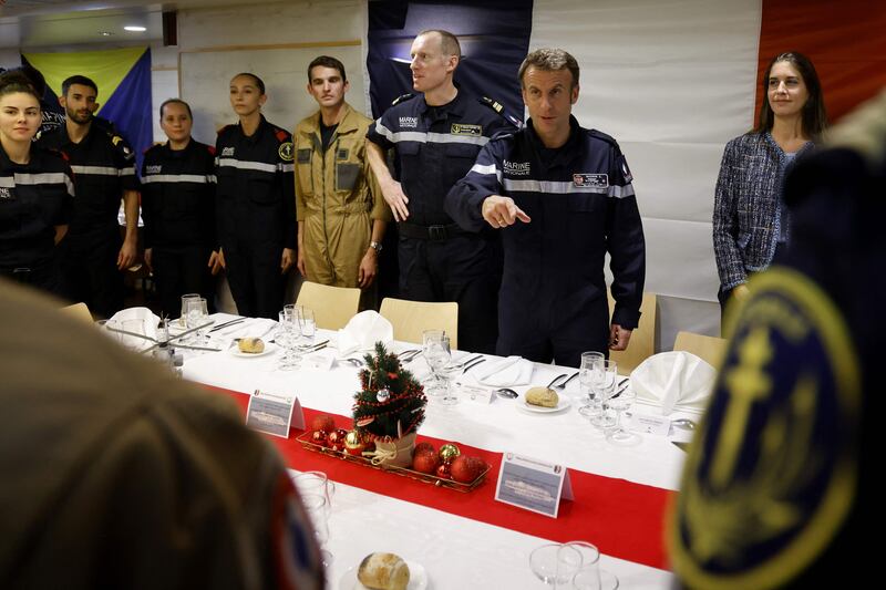 French President Emmanuel Macron (2R) takes part to a special diner with French navy soldiers aboard the French aircraft carrier Charles de Gaulle, sailing between the Suez canal and the Red Sea on December 19, 2022.  - French President Emmanuel Macron joined the French aircraft carrier Charles de Gaulle on December 19, 2022 for the traditional Christmas party with the troops, before attending a regional conference in Jordan on December 20, the Elysee presidential palace announced.  (Photo by Ludovic MARIN  /  POOL  /  AFP)  /  SOLELY FOR SIPA AND ABACA