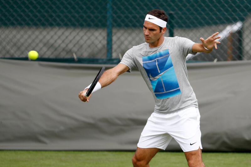 Roger Federer begins his pursuit of an eighth Wimbledon title against Alexandr Dolgopolov on Centre Court. Peter Klaunzer / EPA