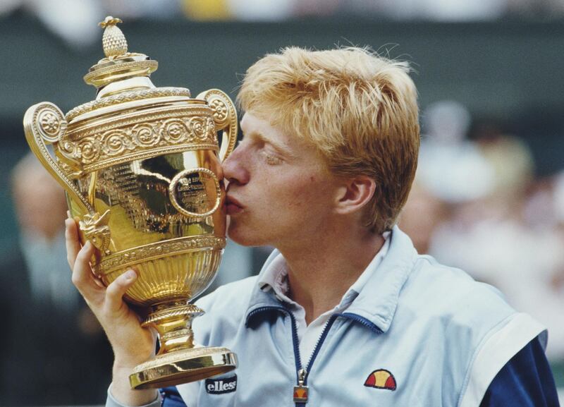 Boris Becker of Germany kisses the Gentleman's trophy to celebrate his victory over Kevin Curren 6-3, 6-7 (4-7), 7-6 (7-3), 6-4 during the Men's Singles final of the Wimbledon Lawn Tennis Championship on 7 July 1985 at the All England Lawn Tennis and Croquet Club in Wimbledon in London, England. It was Becker's 1st career Grand Slam title and his 1st Wimbledon title. (Photo by Steve Powell/Allsport/Getty Images) 