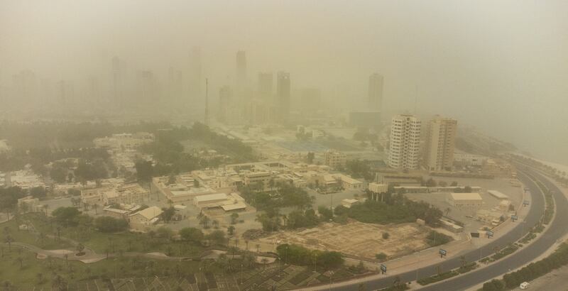 Buildings are shrouded in heavy dust in Kuwait City, Kuwait. The Kuwaiti Ministry of Interior on Sunday cautioned against a prevailing unsteady weather marked with a wave of dust that lowered visibility.   EPA