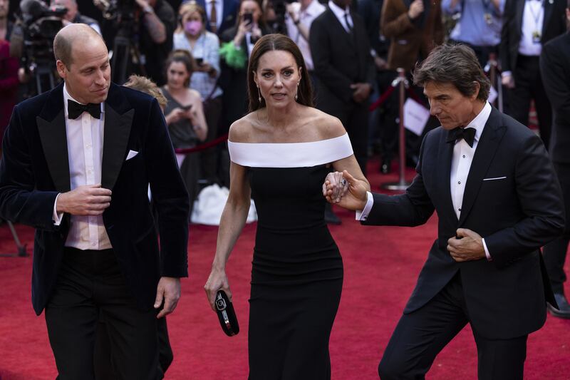 On Thursday evening the Duke and Duchess of Cambridge were accompanied by Hollywood star Tom Cruise as they arrived for the UK premiere of 'Top Gun: Maverick' in Leicester Square, central London. PA