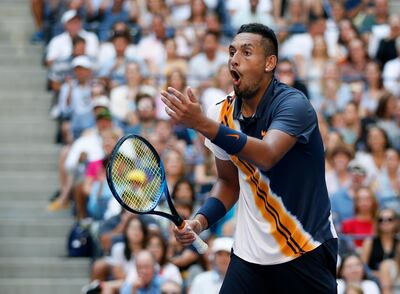 FILE - In this Sept. 1, 2018, file photo, Nick Kyrgios of Australia,reacts to a winning shot by by Roger Federer of Switzerland during the third round of the U.S. Open tennis tournament, in New York. Kyrgios is one of the men to keep an eye on at the Australian Open, Jan. 14-27, 2019.(AP Photo/Jason DeCrow, File)
