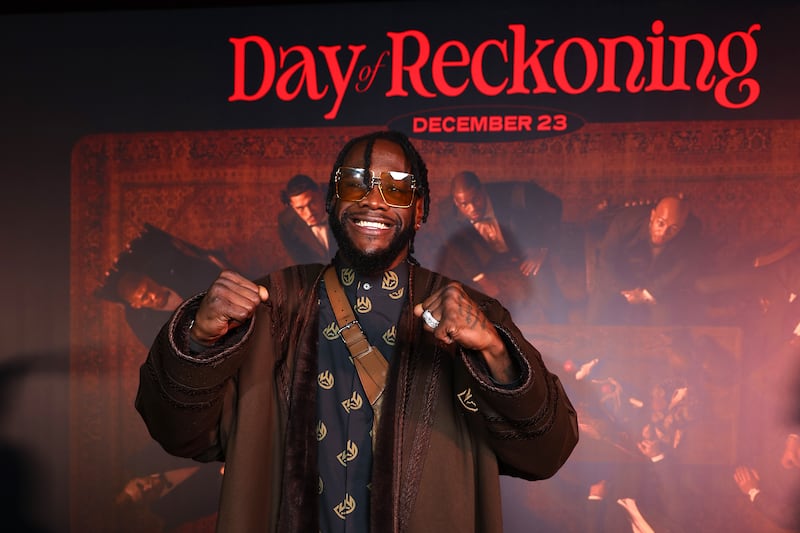 Deontay Wilder poses for a photo as he arrives ahead of the Day of Reckoning fight night. Getty Images