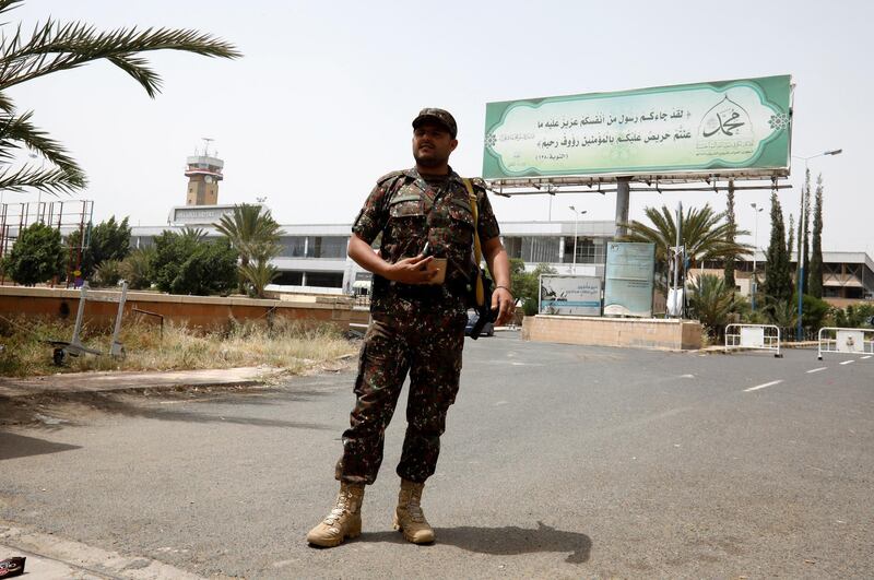 A Yemeni soldier stands guard at the entrance to Sana'a Airport. EPA