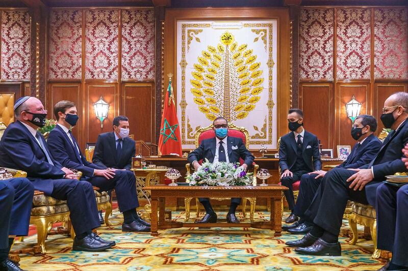 (FILES) In this file handout picture released by the Moroccan Royal Palace King Mohammed VI (C), flanked by his son Crown Prince Moulay Hassan (C R), meets with US Presidential advisor Jared Kushner (2nd L) and Israeli National Security Advisor Meir Ben Shabbat (L) at the Royal Palace in Rabat, on December 22, 2020. US President Donald Trump, in a last-minute push to solidify Morocco's normalization with Israel, bestowed a rare award on January 15, 2021 on its king as his administration rallied international support in a regional dispute. The White House said it presented King Mohammed VI with the Legion of Merit, degree of Chief Commander, five days before Trump's departure in a private ceremony in Washington in which Morocco's ambassador accepted. - RESTRICTED TO EDITORIAL USE - MANDATORY CREDIT "AFP PHOTO / SOURCE / MOROCCAN ROYAL PALACE- NO MARKETING NO ADVERTISING CAMPAIGNS - DISTRIBUTED AS A SERVICE TO CLIENTS


 / AFP / Moroccan Royal Palace / - / RESTRICTED TO EDITORIAL USE - MANDATORY CREDIT "AFP PHOTO / SOURCE / MOROCCAN ROYAL PALACE- NO MARKETING NO ADVERTISING CAMPAIGNS - DISTRIBUTED AS A SERVICE TO CLIENTS


