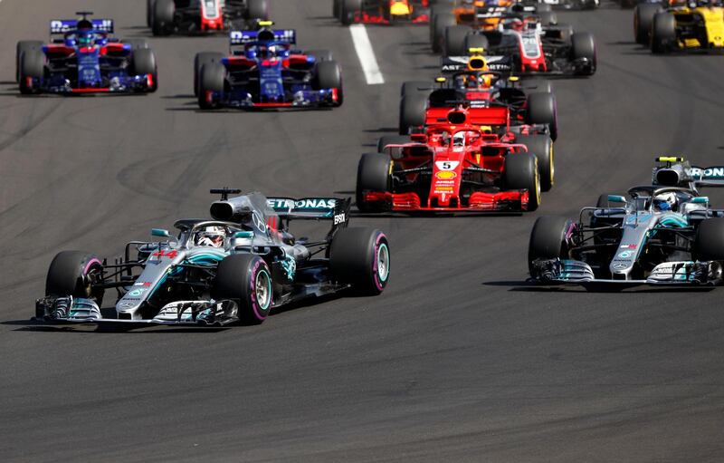 Mercedes driver Lewis Hamilton of Britain, left, leads at the start of the Hungarian Formula One Grand Prix, at the Hungaroring racetrack in Mogyorod, northeast of Budapest, Sunday, July 29, 2018. (AP Photo/Laszlo Balogh)