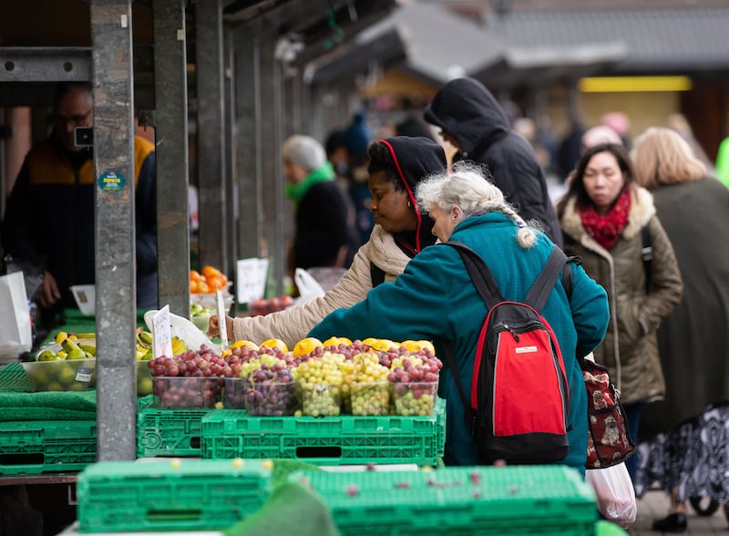 Shoppers at a fruit and vegetable market in Leeds. EPA