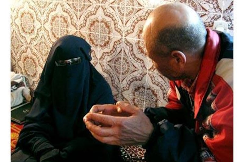 Fatiha Hassani confers with Abderrahim Mouhtad, who leads the human rights group An Naseer.