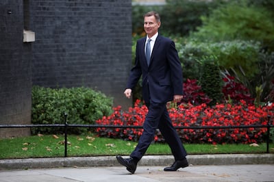 Jeremy Hunt walks outside Downing Street in London. Reuters