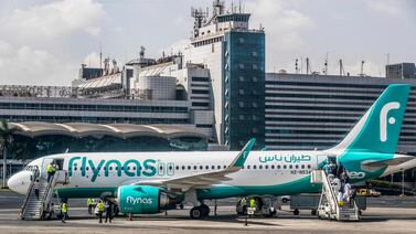 Saudi Arabian low-cost airline Flynas' Airbus A320 aircraft on the tarmac at Cairo International Airport.  AFP