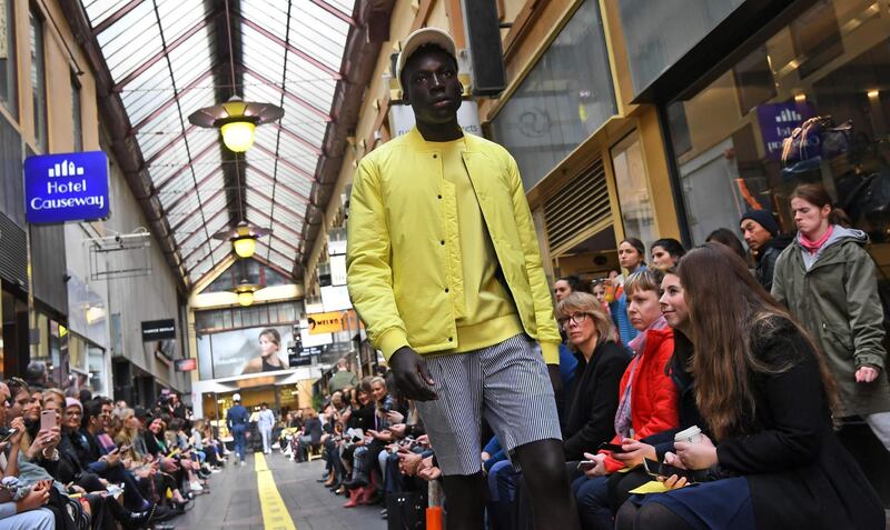 A model presents an outfit by Australian label Aquila in a runway show. AFP