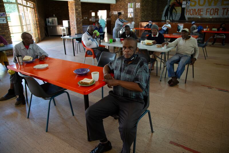 Residents of the Soweto Home for the Aged social distancing during breakfast in Johannesburg. AP Photo