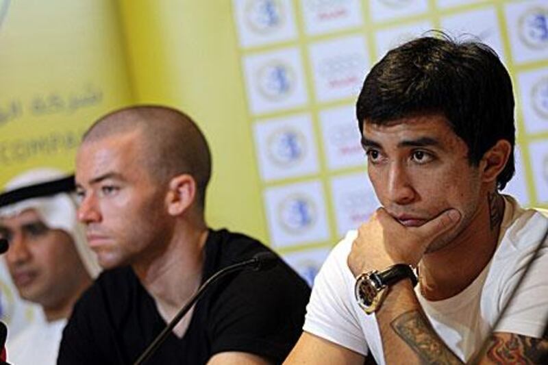 Argentine Mariano Donda, left, and Chile's Edson Puch looked at ease with each other at the news conference in Dubai.