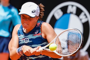 Iga Swiatek of Poland in action during her women's singles final match against Ons Jabeur of Tunisia at the Italian Open tennis tournament in Rome, Italy, 15 May 2022.   EPA / FABIO FRUSTACI