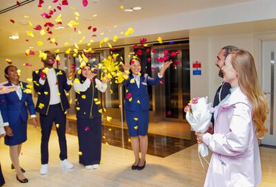 The couple being congratulated by DXB Hotel staff following the proposal. Photo: Dubai Airports