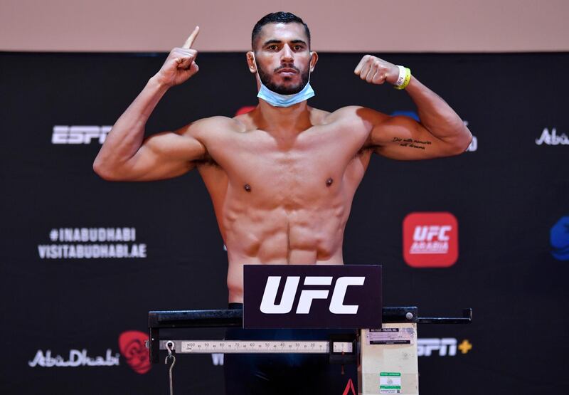 ABU DHABI, UNITED ARAB EMIRATES - JULY 14: Mounir Lazzez of Tunisia poses on the scale during the UFC Fight Night weigh-in inside Flash Forum on UFC Fight Island on July 14, 2020 in Yas Island, Abu Dhabi, United Arab Emirates. (Photo by Jeff Bottari/Zuffa LLC via Getty Images)