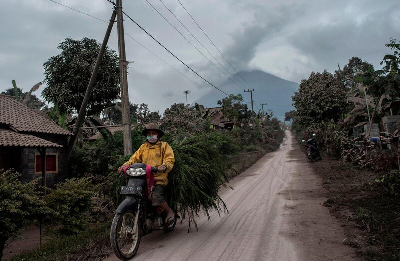 Mount Semeru looms over the village of Lumajang, East Java. AFP