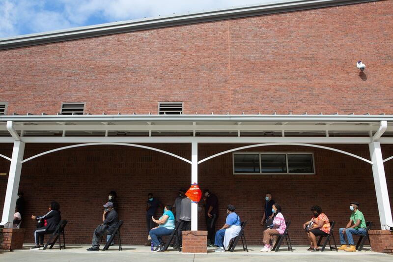 People wait in line on the first day of early voting for the general election at the C.T. Martin Natatorium and Recreation Center in Atlanta, Georgia. AFP