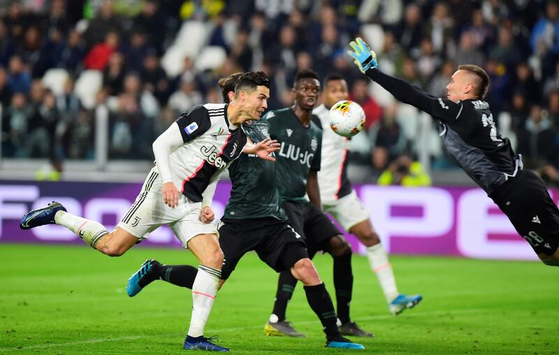 Soccer Football - Serie A - Juventus v Bologna - Allianz Stadium, Turin, Italy Juventus' Cristiano Ronaldo heads at goal. REUTERS