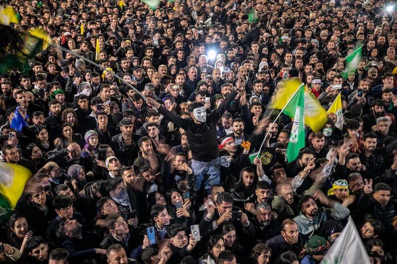 Supporters of the pro-Kurdish Peoples' Equality and Democracy Party (DEM) celebrate after authorities reversed a decision to revoke the mandate of newly elected mayor Abdullah Zeydan, in Van, eastern Turkey. EPA