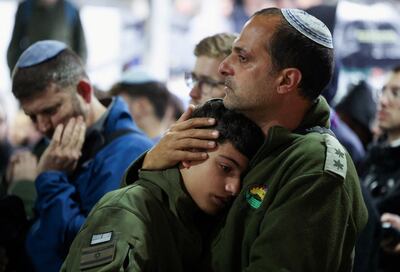 People mourn an Israeli soldier killed in the October 7 attack on Israel after the Israeli government confirmed his body is being kept by Hamas. Reuters