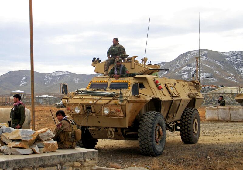 FILE PHOTO: Afghan National Army soldiers keep watch outside of a military compound after a car bomb blast on the outskirts of Ghazni city, Afghanistan November 29, 2020. REUTERS/Mustafa Andaleb/File Photo