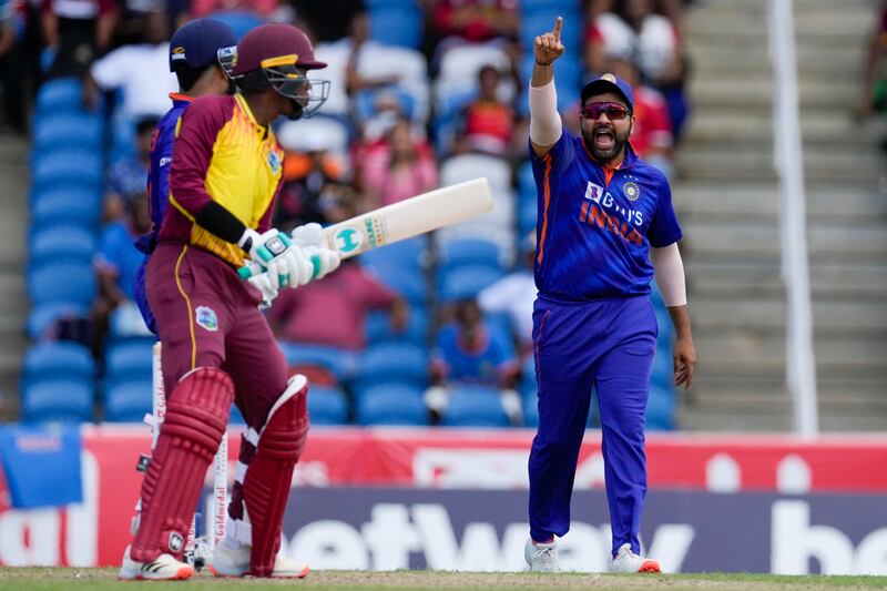 India's captain Rohit Sharma appeals for the wicket of West Indies' Akeal Hosein during the first T20 cricket match at Brian Lara Cricket Academy in Tarouba, Trinidad and Tobago, Friday, July 29, 2022.  (AP Photo / Ricardo Mazalan)