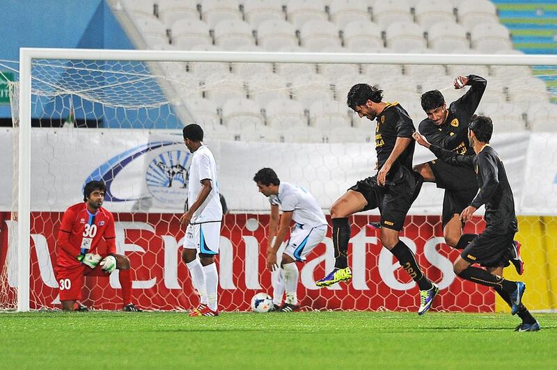 Players of Al Qadsia, right, celebrate following a goal against Baniyas during their Asian Champions League play-off. Abdullateef Al Marzouqi / Al Ittihad

