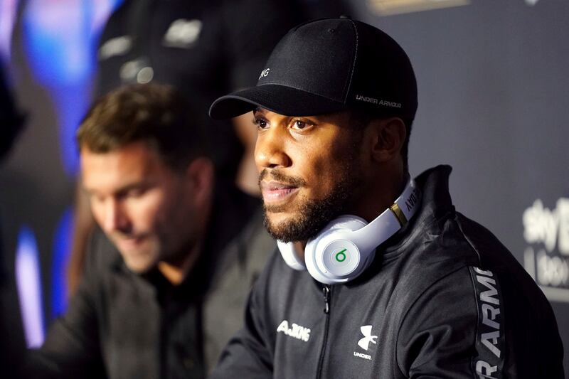 British boxer Anthony Joshua with promoter Eddie Hearn in the background. PA