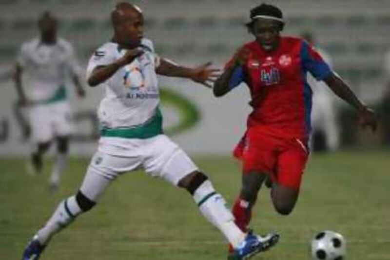 DUBAI-SEPTEMBER 21,2008 - Joodvin Atram of Al Shaab team in action against Al Shabab Marcos Assuncao during UAE Football League game at Al Shabab stadium in Dubai. Al Shabab wins 2-0 over Al Shaab. ( Paulo Vecina/The National )  *** Local Caption ***  PV UFL 20.JPG