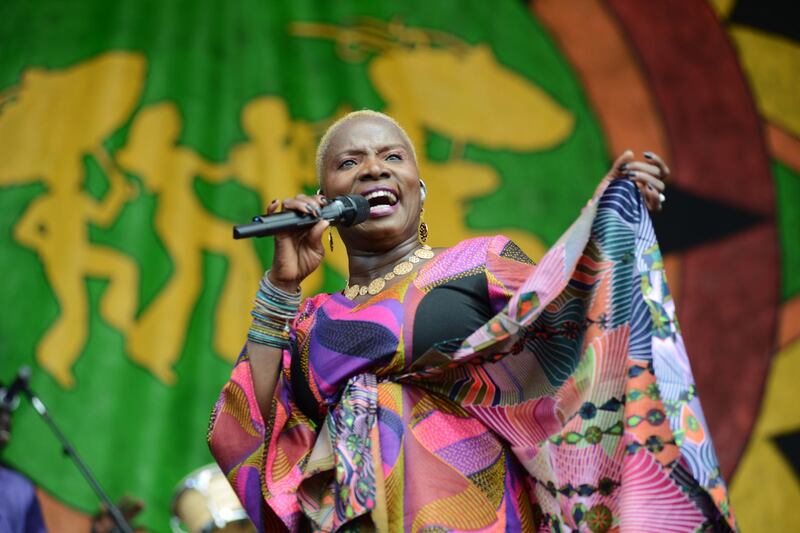 NEW ORLEANS, LA - APRIL 26:  Angelique Kidjo performs on stage at the New Orleans Jazz and Heritage Festival on April 26, 2015 in New Orleans, United States  (Photo by Leon Morris/Redferns via Getty Images)
