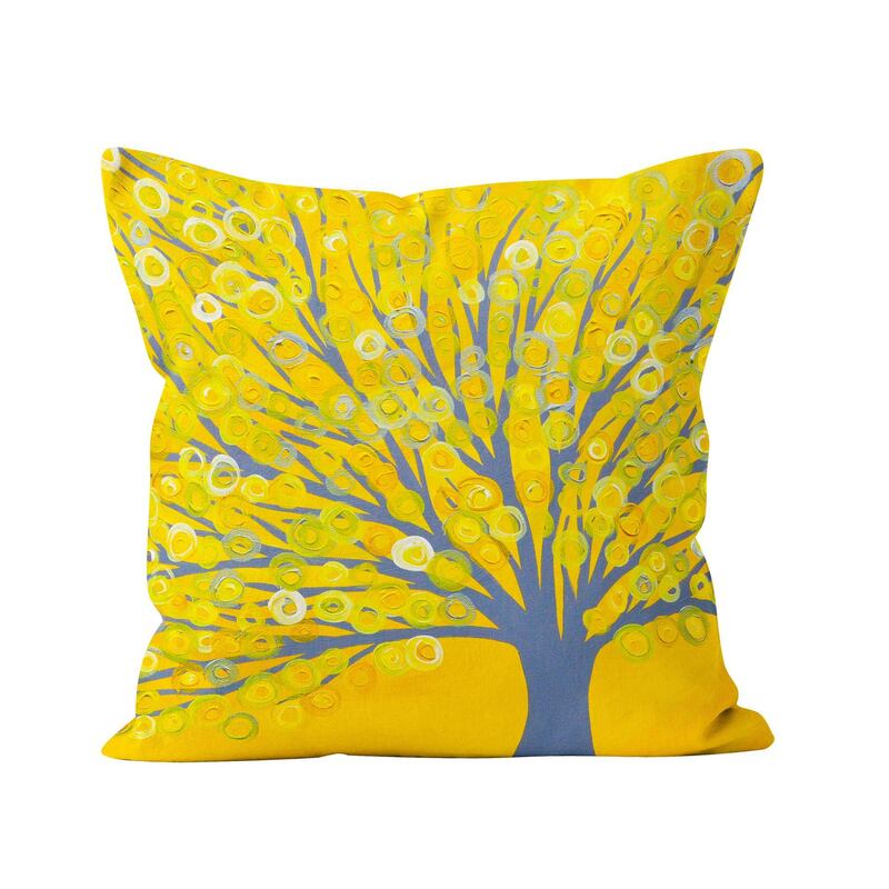 The shade lends itself well to floral and botanical prints. Seen here, a yellow and grey Tree cushion from Louise Mead