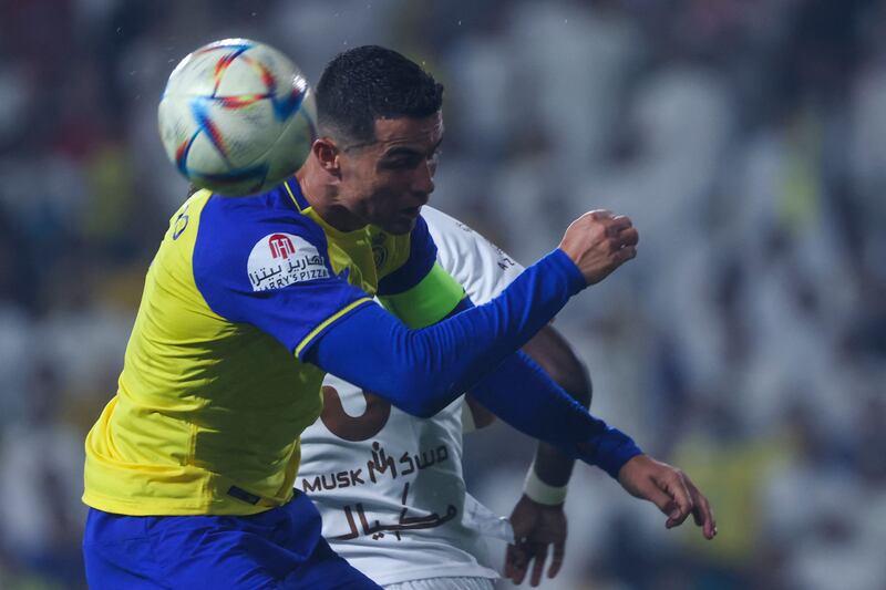Al Nassr's Portuguese forward Cristiano Ronaldo heads the ball.  AFP