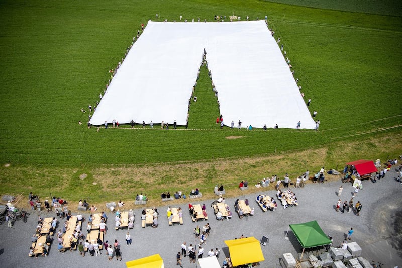 What are claimed to be the biggest pair of trousers in the world are unfurled in the town of Beromuenster, in Lucerne canton, Switzerland. EPA