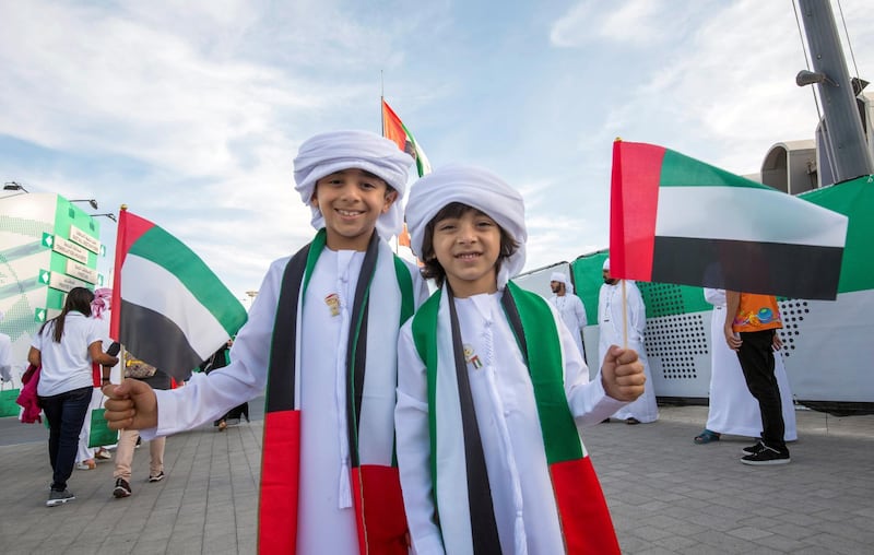 ABU DHABI, UNITED ARAB EMIRATES - Children celebrating UAE National day with flags and accessories at Zayed Sports City, Abu Dhabi.  Leslie Pableo for The National