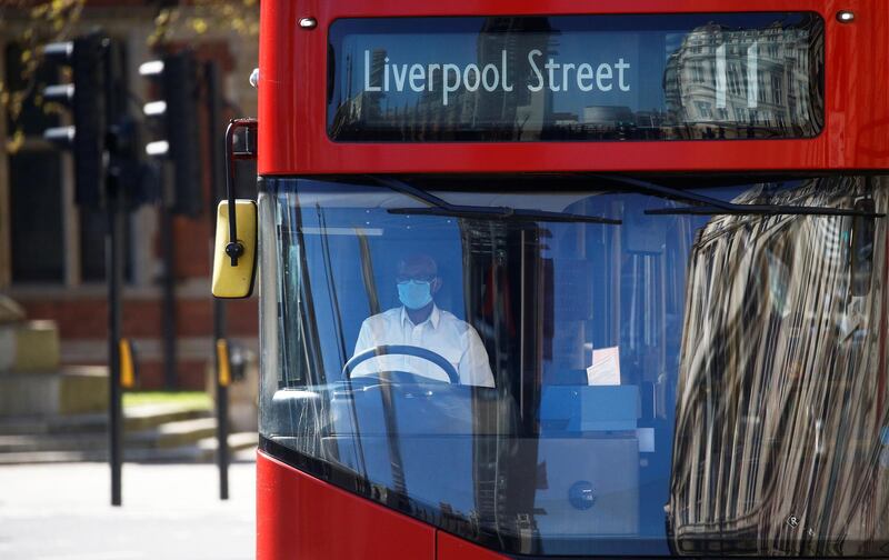 A bus driver wearing a face mask is seen in London, UK on April 5, 2020. Reuters