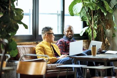 Coworkers meeting in creative office space, relaxation, collaboration, cooperation