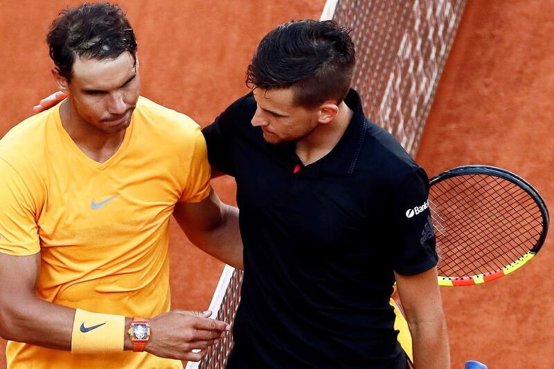 epa06728649 Austria's Dominic Thiem (R) is congratulated by Rafael Nadal (L) of Spain after winning their quarter final match of the 2018 Mutua Madrid Open tennis tournament at Caja Magica in Madrid, Spain, 11 May 2018.  EPA/MARISCAL