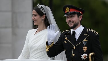 Jordan's Crown Prince Hussein and Princess Rajwa wave to well-wishers during their wedding ceremonies in Amman. AP