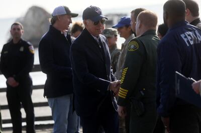 US President Joe Biden talks to first responders with Governor Gavin Newsom at storm-damaged Seacliff State Park. Reuters