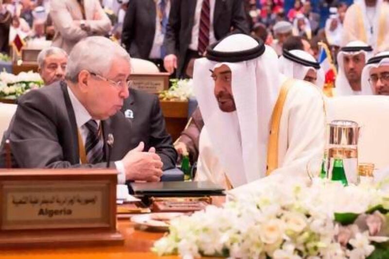 Sheikh Mohammed bin Zayed with Algeria's representative Abdel Qadir bin Saleh at the international donors conference in Kuwait.