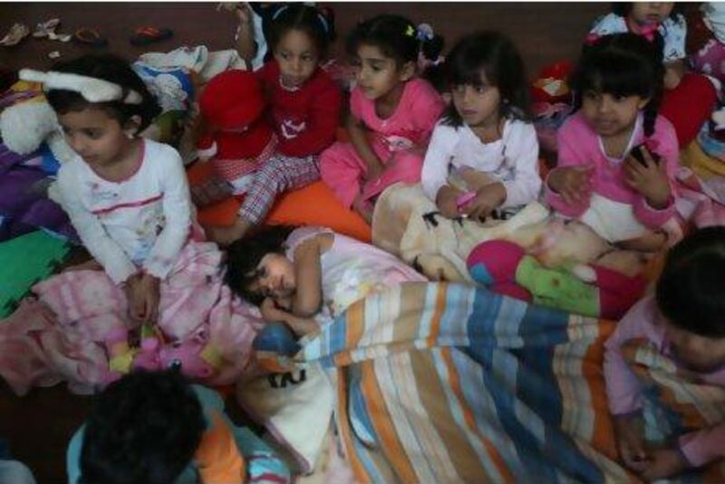 Girls at Al Ain American School prepare for a nap as part of a day showing them the importance of a sleeping routine.