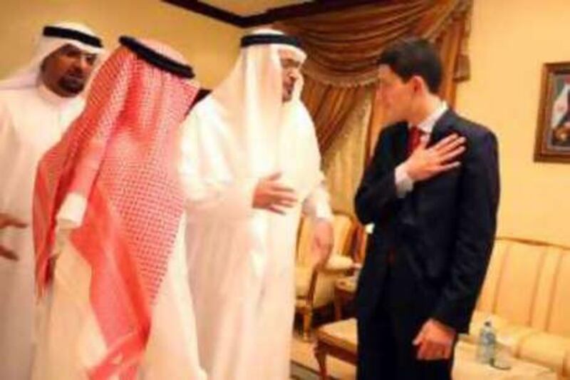 The British foreign secretary, David Miliband, meets dignitaries yesterday.