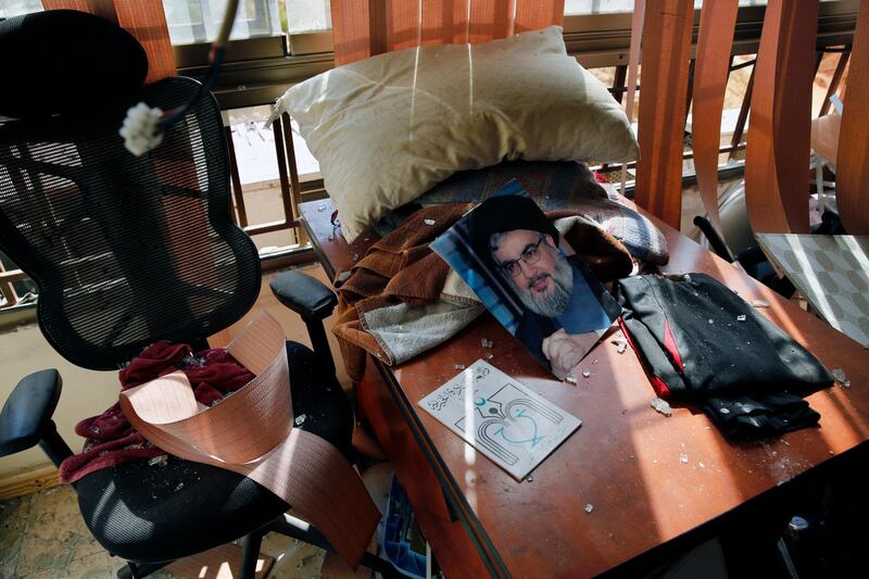 A picture of Hezbollah leader Hassan Nasrallah lies amid the debris in a Lebanese Hezbollah media office after a drone exploded. AP