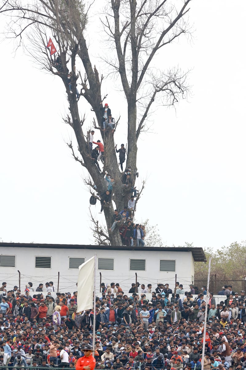 Crowd took up every available vantage point to watch the Cricket World Cup League 2 match between the UAE and Nepal at the TU International Cricket Stadium