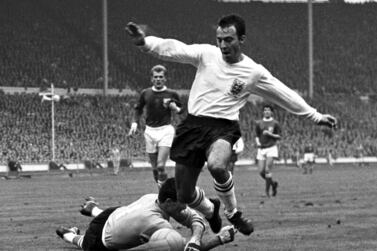 FILE - In this Oct.  23, 1965 file photo, England inside-right Jimmy Greaves vies for the ball against Yugoslav goalkeeper Milutin Soskic during the second half of the Football Association football match between England and the Rest of the World at Wembley Stadium, London.  Jimmy Greaves, one of England’s greatest goal-scorers who was prolific for Tottenham, Chelsea and AC Milan has died.  He was 81.  With 266 goals in 379 appearances, Greaves was the all-time record scorer for Tottenham, which announced his death on Sunday, Sept.  19, 2021.  (AP Photo / Robert Rider-Rider, File)