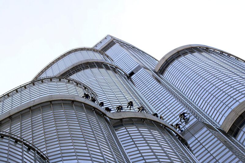 Dubai, United Arab Emirates - September 17, 2019: Between the 111th and 73rd floor, 11 window cleaners clean the outside of the Burj Khalifa, the worlds tallest building. Tuesday the 17th of September 2019. Downtown, Dubai. Chris Whiteoak / The National