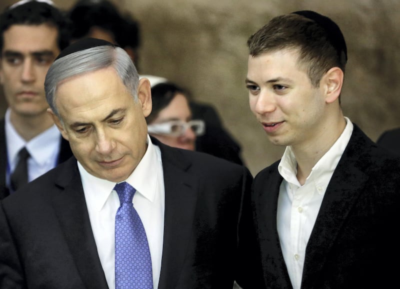 A picture taken on March 18, 2015 shows Israeli Prime Minister Benjamin Netanyahu (L) and his son Yair visiting the Wailing Wall in Jerusalem.
The son of Israeli Prime Minister Benjamin Netanyahu faced online criticism on September 9, 2017 after sharing an image on his Facebook page deemed anti-Semitic by critics. / AFP PHOTO / THOMAS COEX