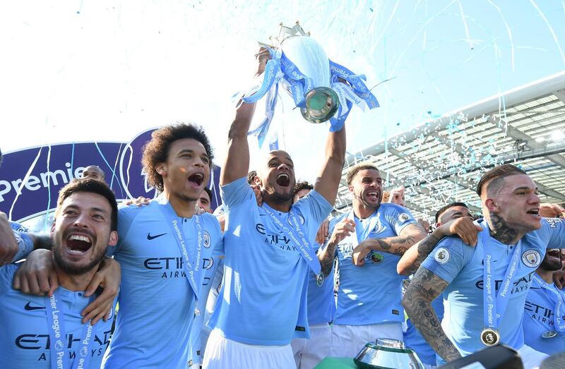 Manchester City players celebrate after beating Brighton 4-1 at the Amex Stadium to be crowned Premier League champions. Getty Images